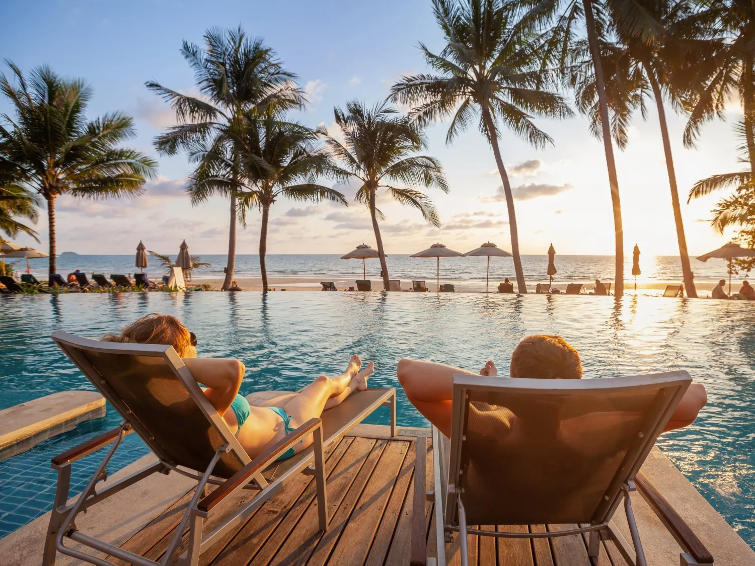 People sunbathing at a hotel pool