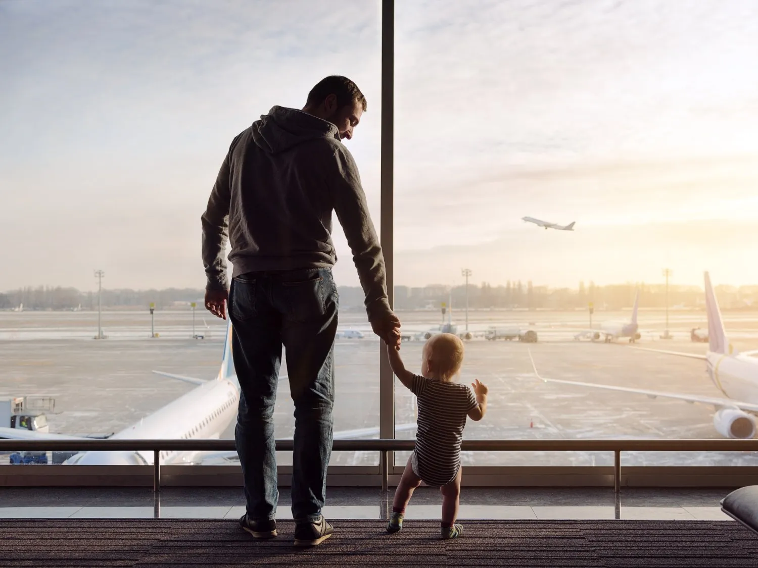 Father and child at an airport