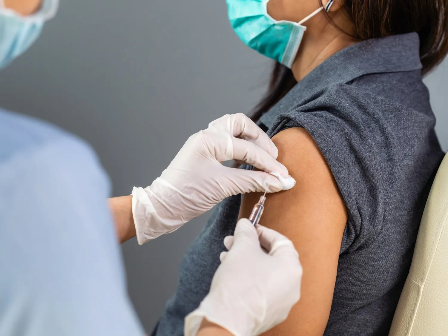 Lady getting a vaccine