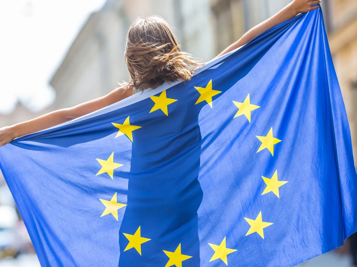 Person holding flag of the European Union