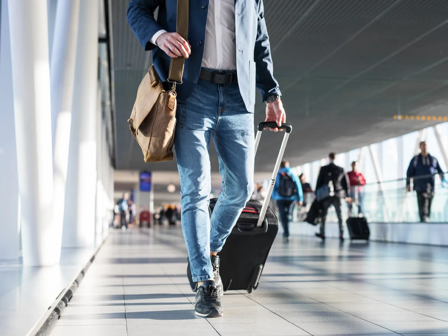 Traveller with a suitcase in an airport